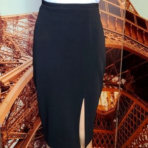 Black pencil skirt with slit at front hem. Size M. #2-0230